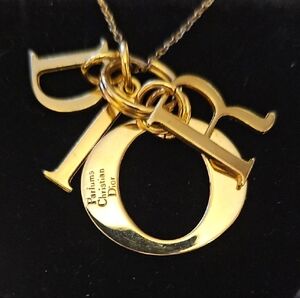 Dior Luxurious Gold Letter Necklace. It Is A Bauble From Dior Parfum